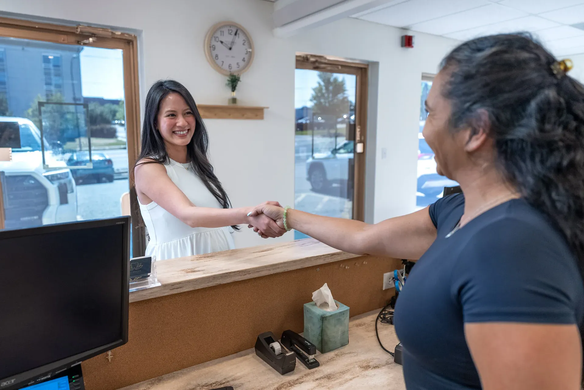 A patient being greeted at the Colorado Dental Spa front desk in Golden, CO