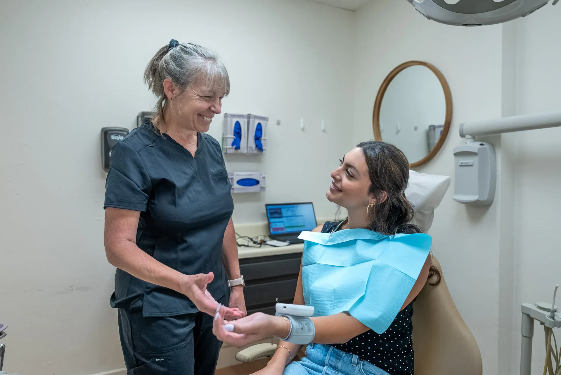A Colorado Dental Spa hygienist talking a patient through their visit in Golden, CO