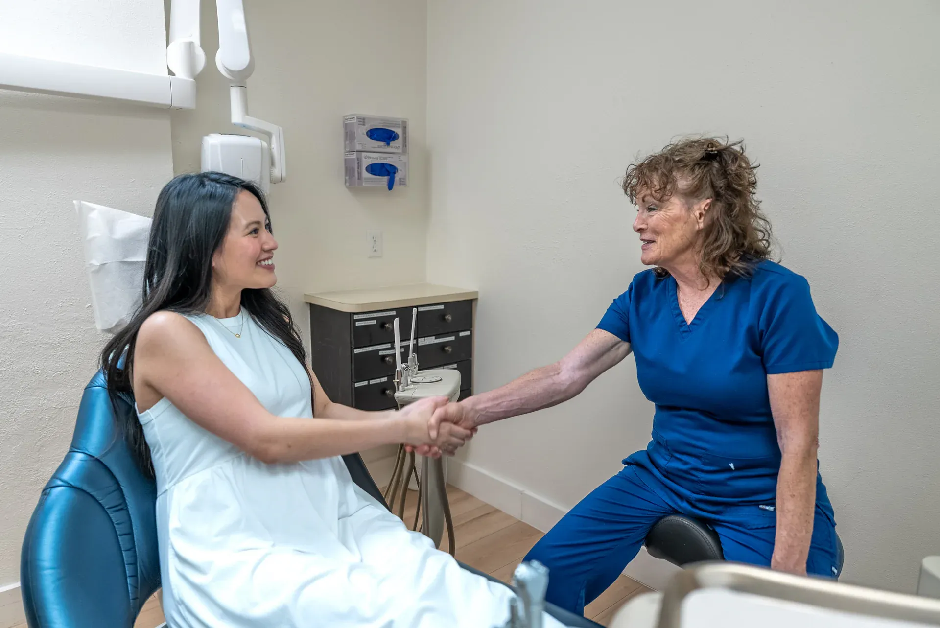 A hygienist welcoming a new patient at Colorado Dental Spa in Golden, CO