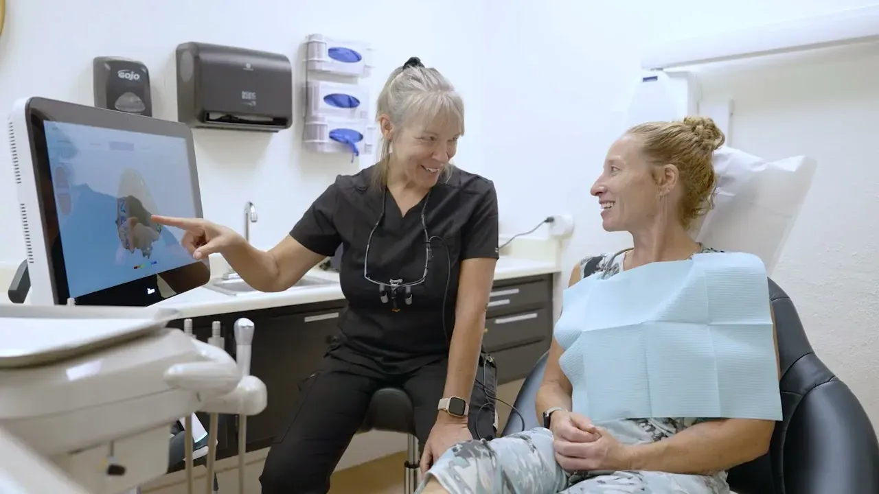 A Colorado Dental Spa patient talking with a hygienist about her digital scan in Golden, CO